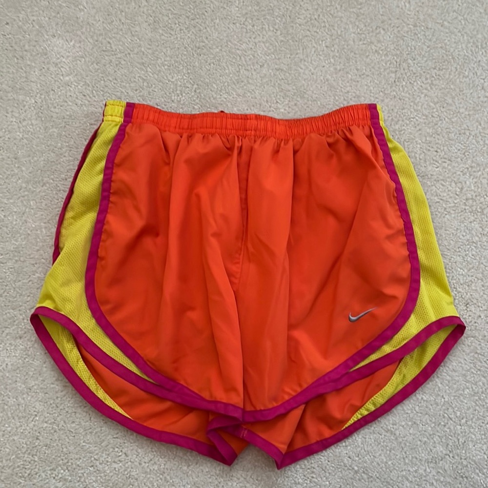 Nike Dri-fit running shorts, size M, bright orange with yellow and pink details